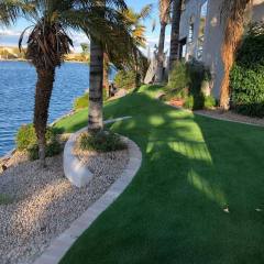 A beautiful backyard slopes down to the water in Scottsdale, AZ