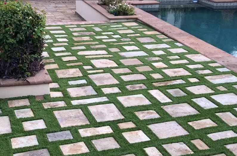 Artificial grass and stone pavers